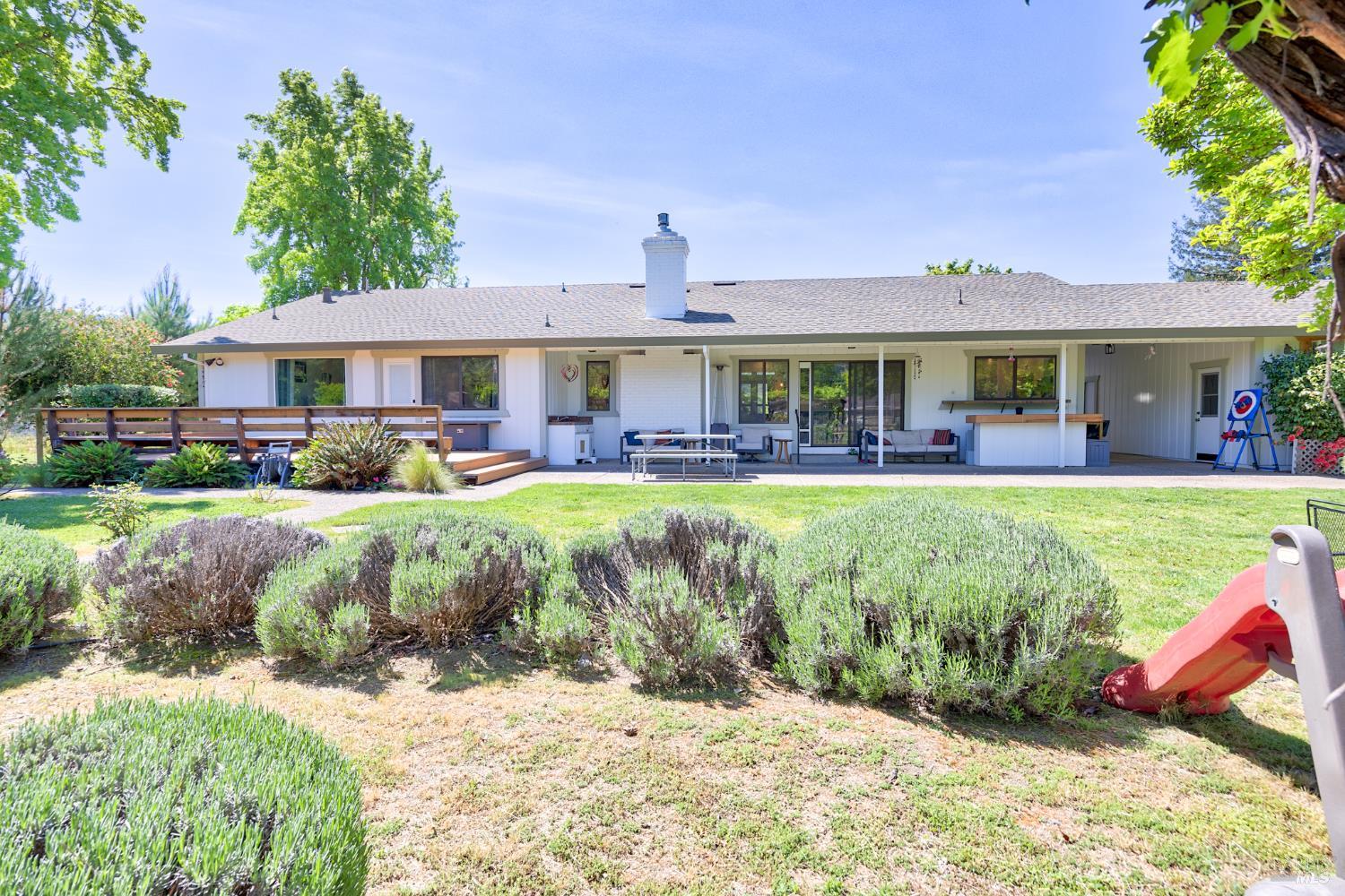 6282 Melita Road Santa Rosa, CA 95409 - Photo 41 of 55 a front view of a house with a yard table and chairs