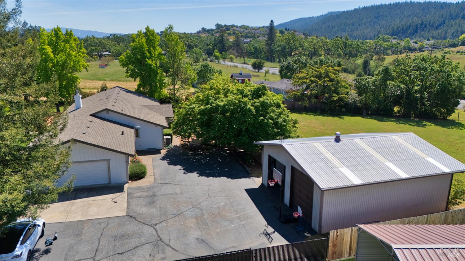 6282 Melita Road Santa Rosa, CA 95409 - Photo 48 of 55 an aerial view of a house with a yard and trees