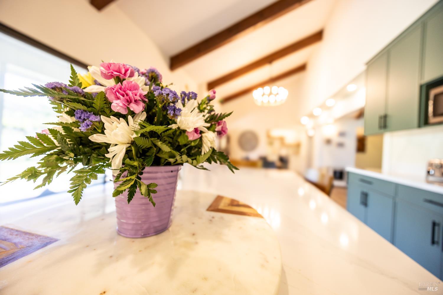 6282 Melita Road Santa Rosa, CA 95409 - Photo 5 of 55 a view of a vase of flowers sitting on a table