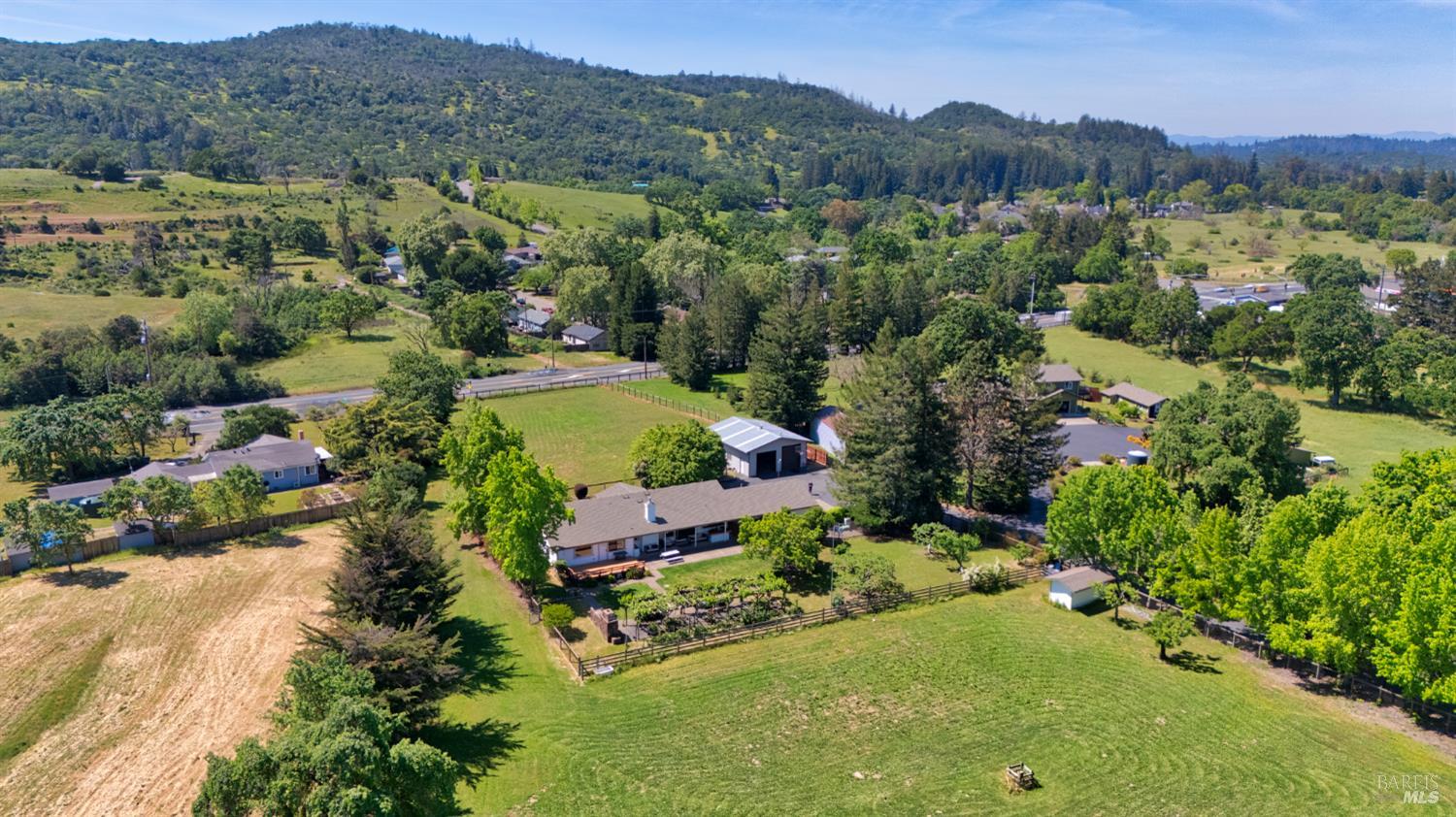 6282 Melita Road Santa Rosa, CA 95409 - Photo 52 of 55 an aerial view of green landscape with trees houses and mountain view