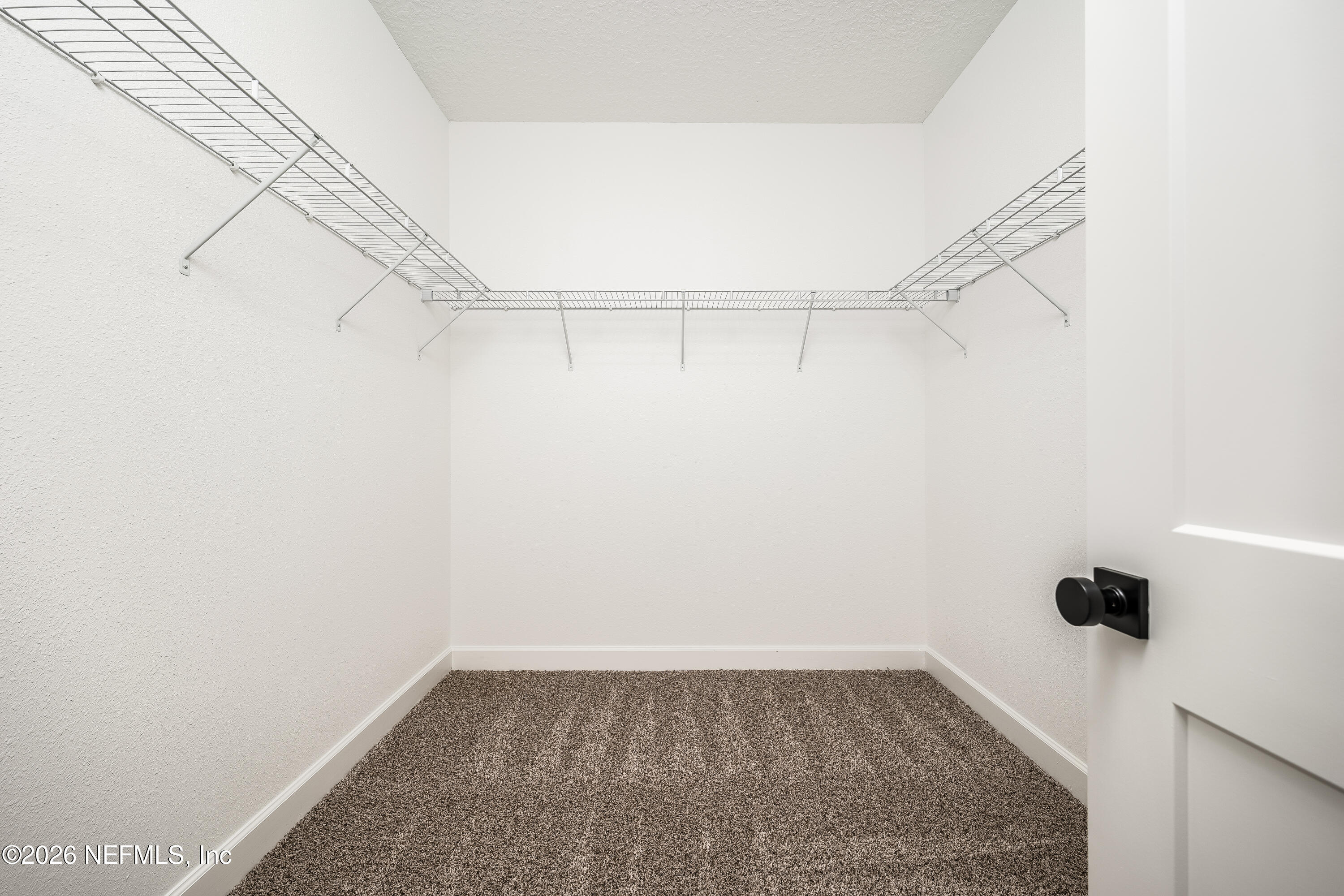 4455 Southeast 3rd Place Keystone Heights, FL 32656 - Photo 11 of 25 a view of a room with racks on the wall