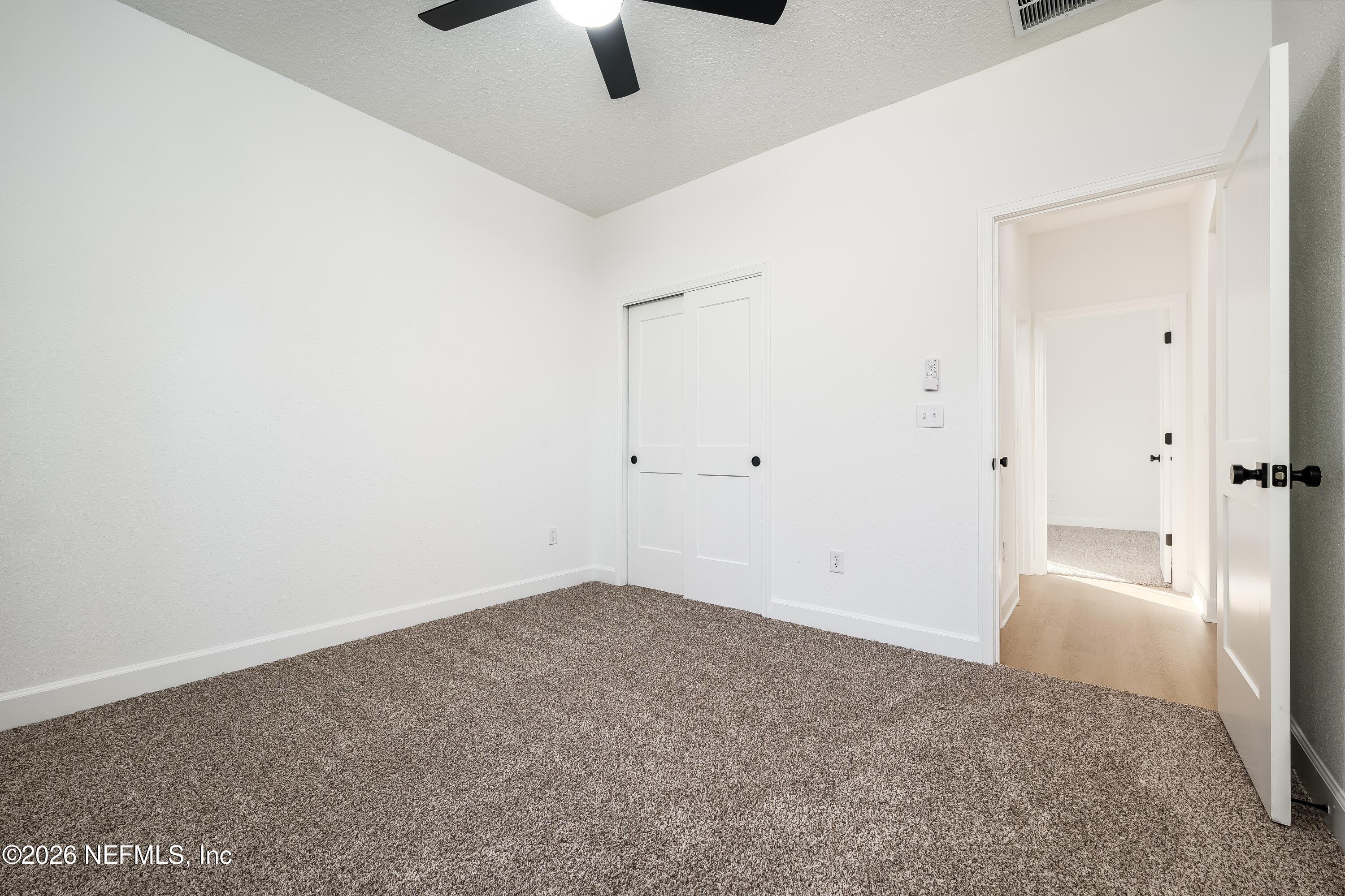 4455 Southeast 3rd Place Keystone Heights, FL 32656 - Photo 13 of 25 an empty room with fan