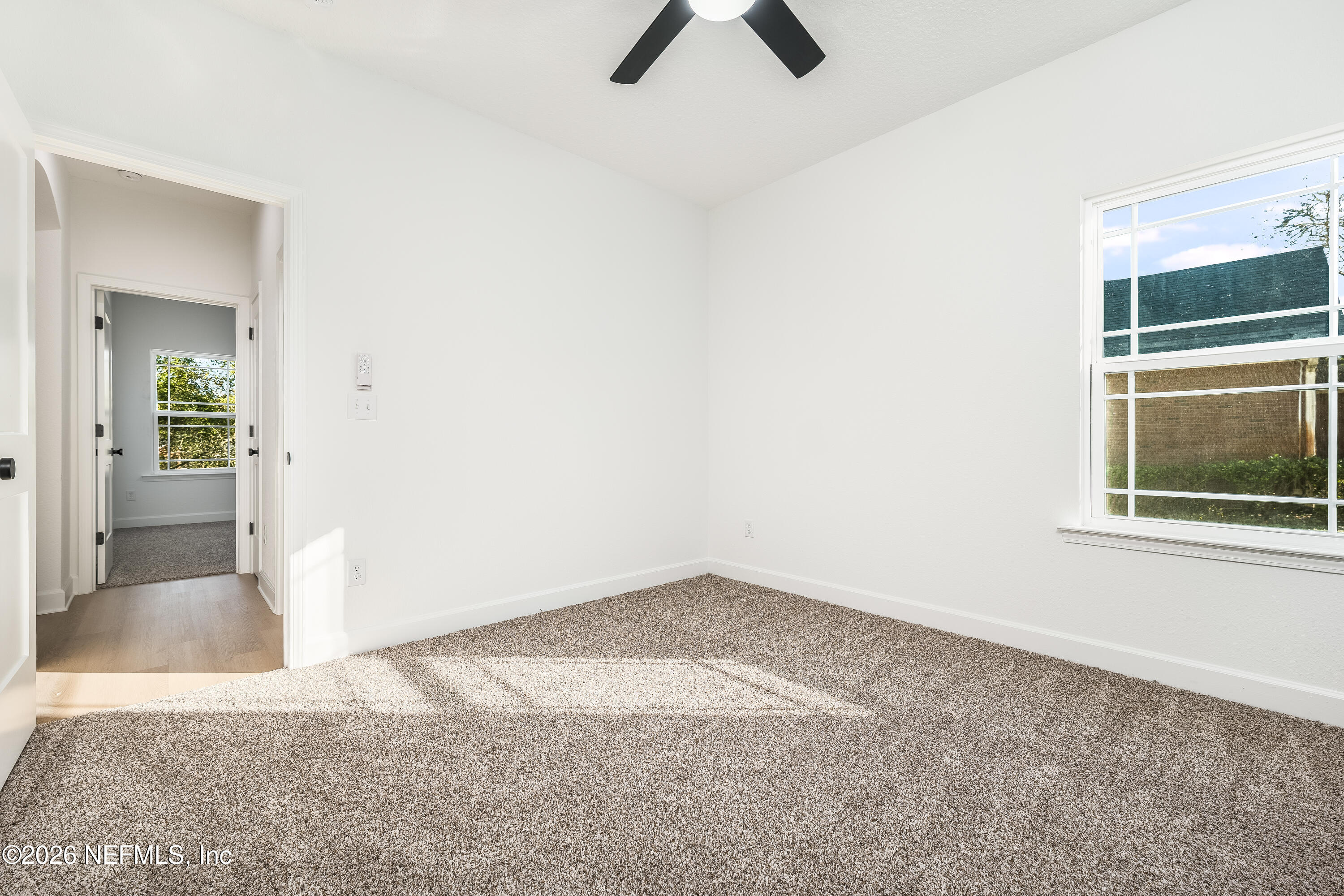 4455 Southeast 3rd Place Keystone Heights, FL 32656 - Photo 15 of 25 an empty room with fan and windows