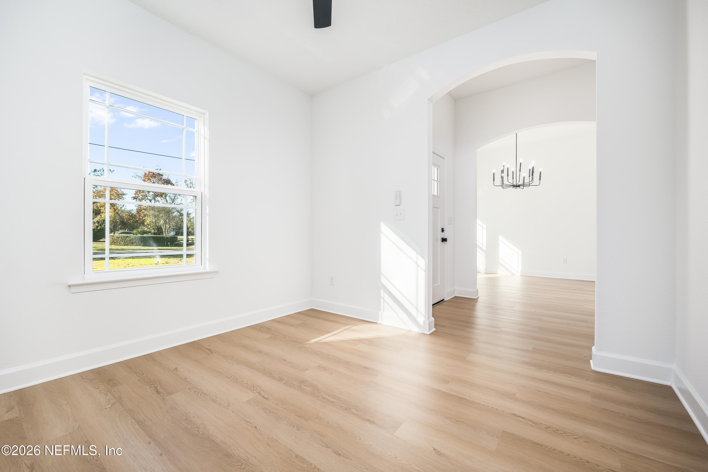 4455 Southeast 3rd Place Keystone Heights, FL 32656 - Photo 18 of 25 a view of an empty room with wooden floor and a window
