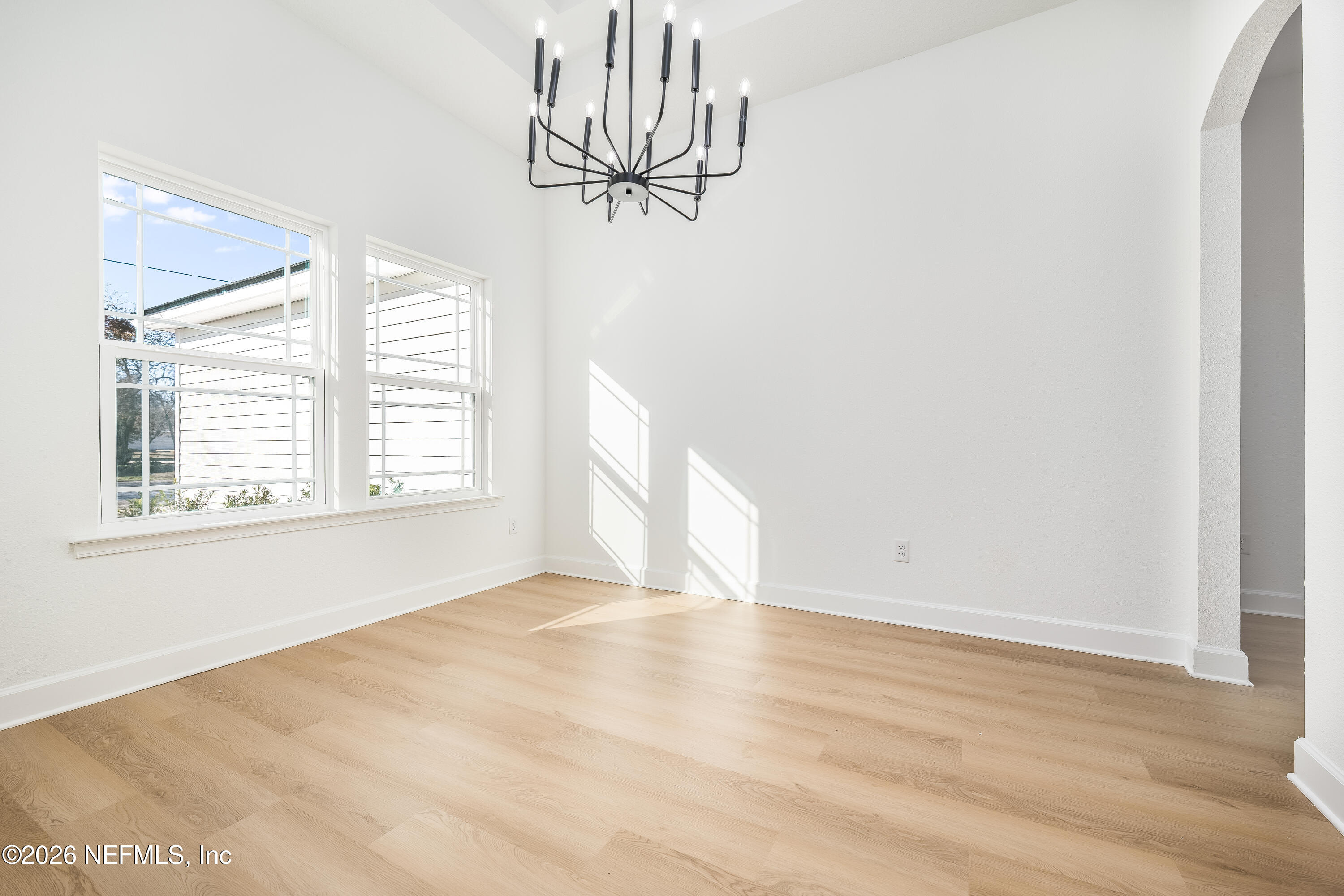 4455 Southeast 3rd Place Keystone Heights, FL 32656 - Photo 19 of 25 a view of empty room with window and wooden floor