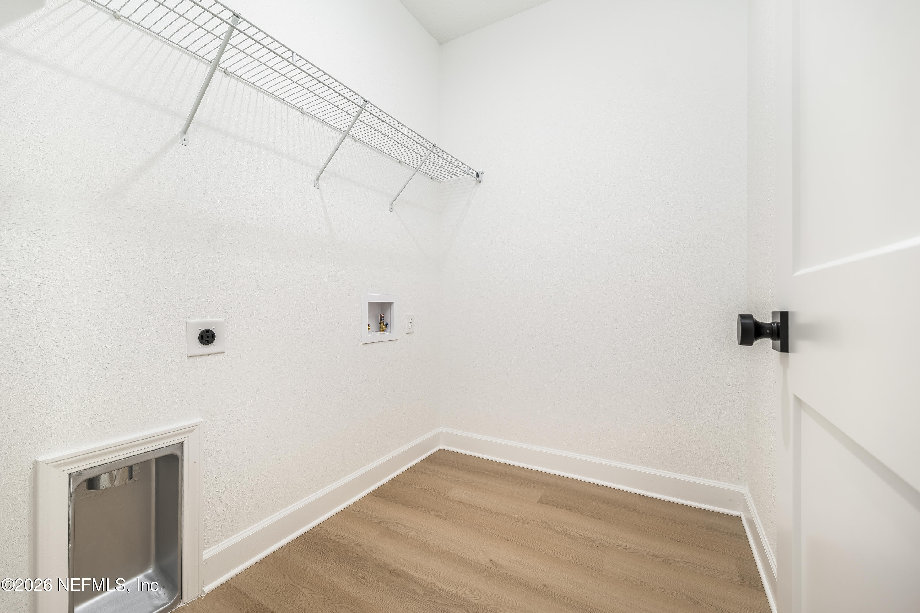 4455 Southeast 3rd Place Keystone Heights, FL 32656 - Photo 22 of 25 a view of a room with racks on the wall
