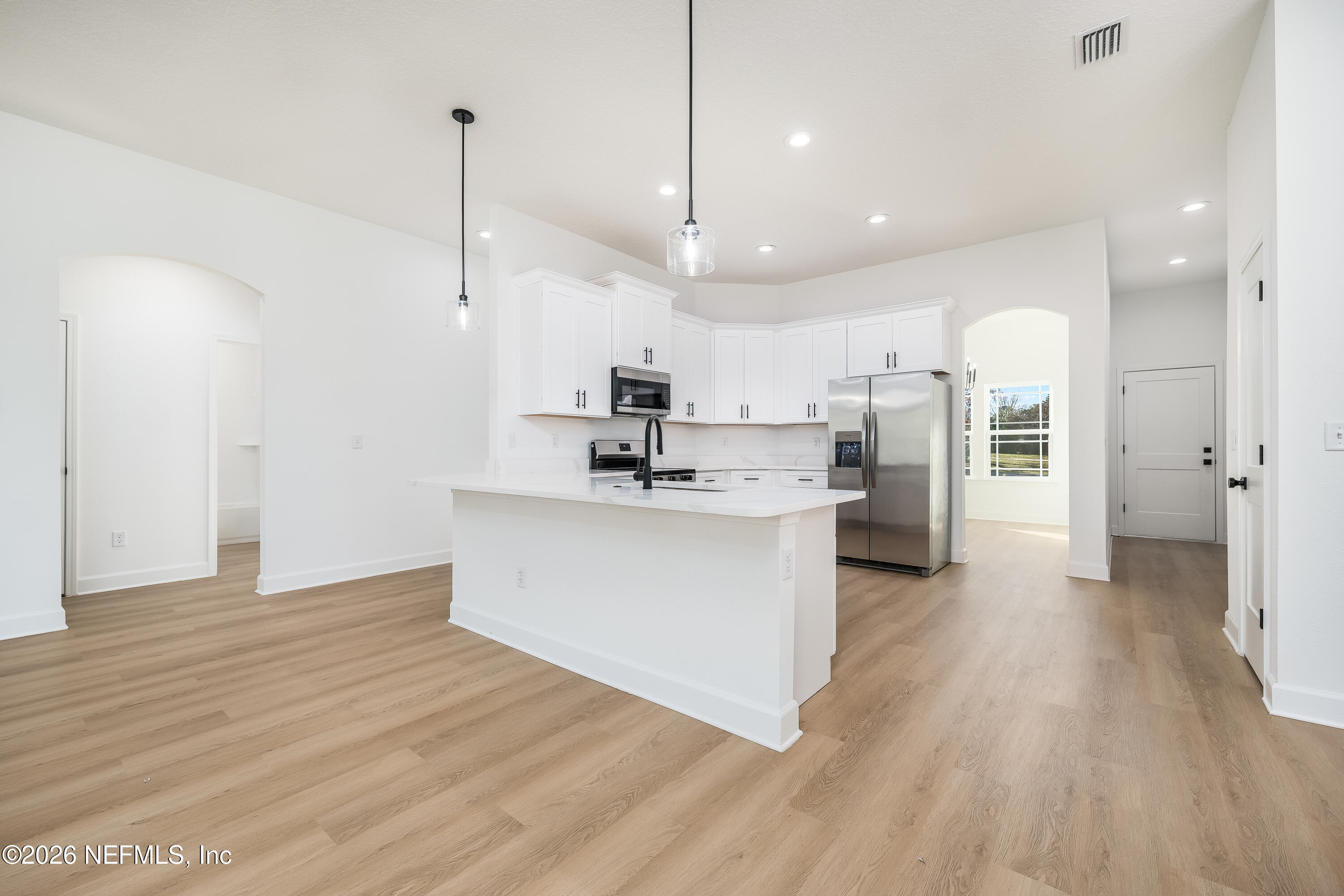 4455 Southeast 3rd Place Keystone Heights, FL 32656 - Photo 3 of 25 a view of kitchen with white cabinets stainless steel appliances
