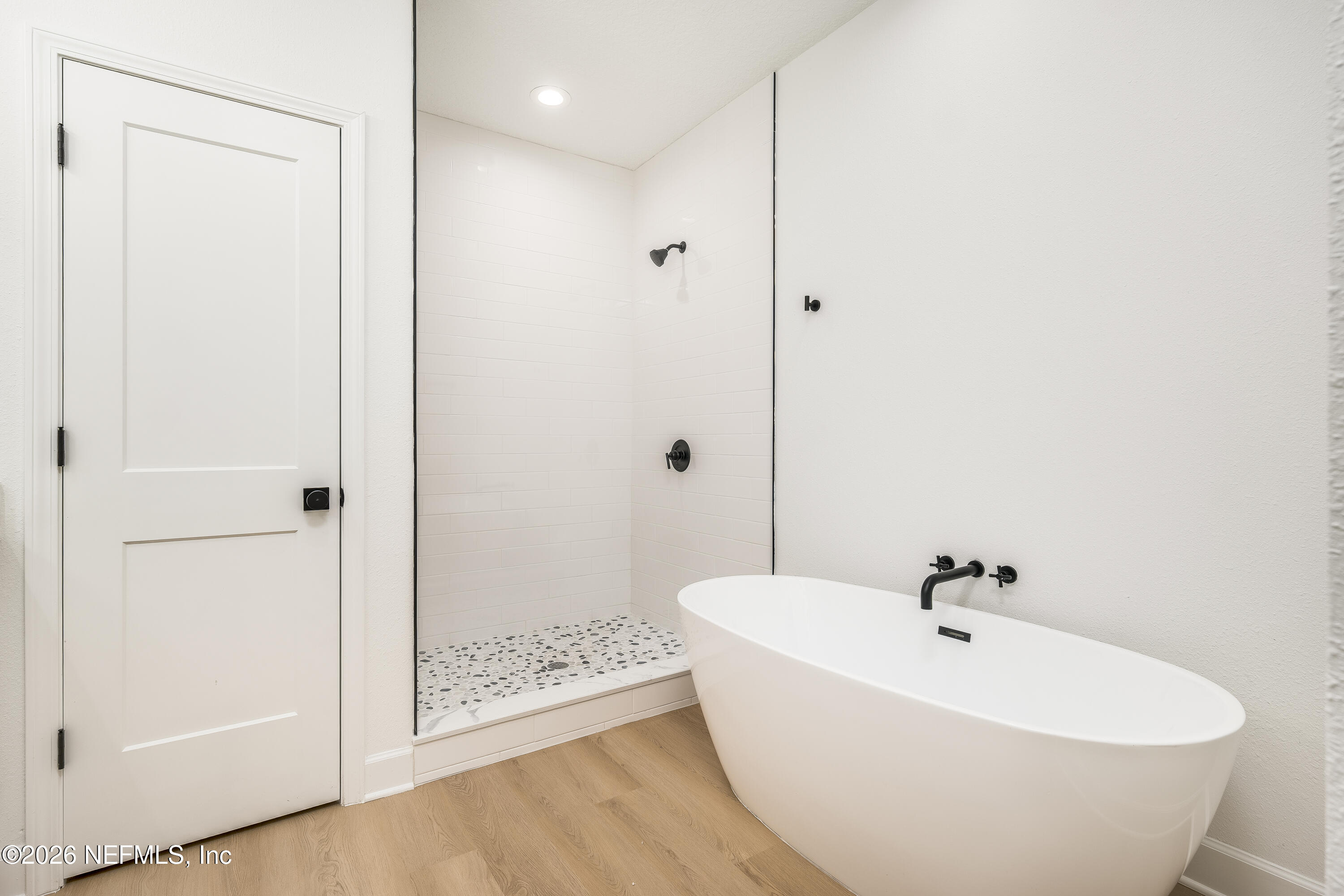 4455 Southeast 3rd Place Keystone Heights, FL 32656 - Photo 10 of 25 a white bath tub sitting in a bathroom