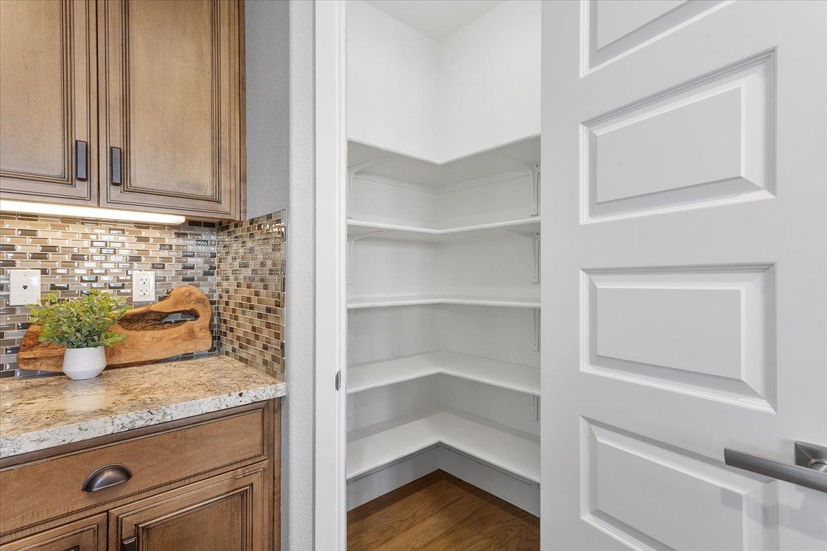 406 Mosley Avenue Alameda, CA 94501 - Photo 16 of 60 a kitchen with granite countertop cabinets and wooden floor