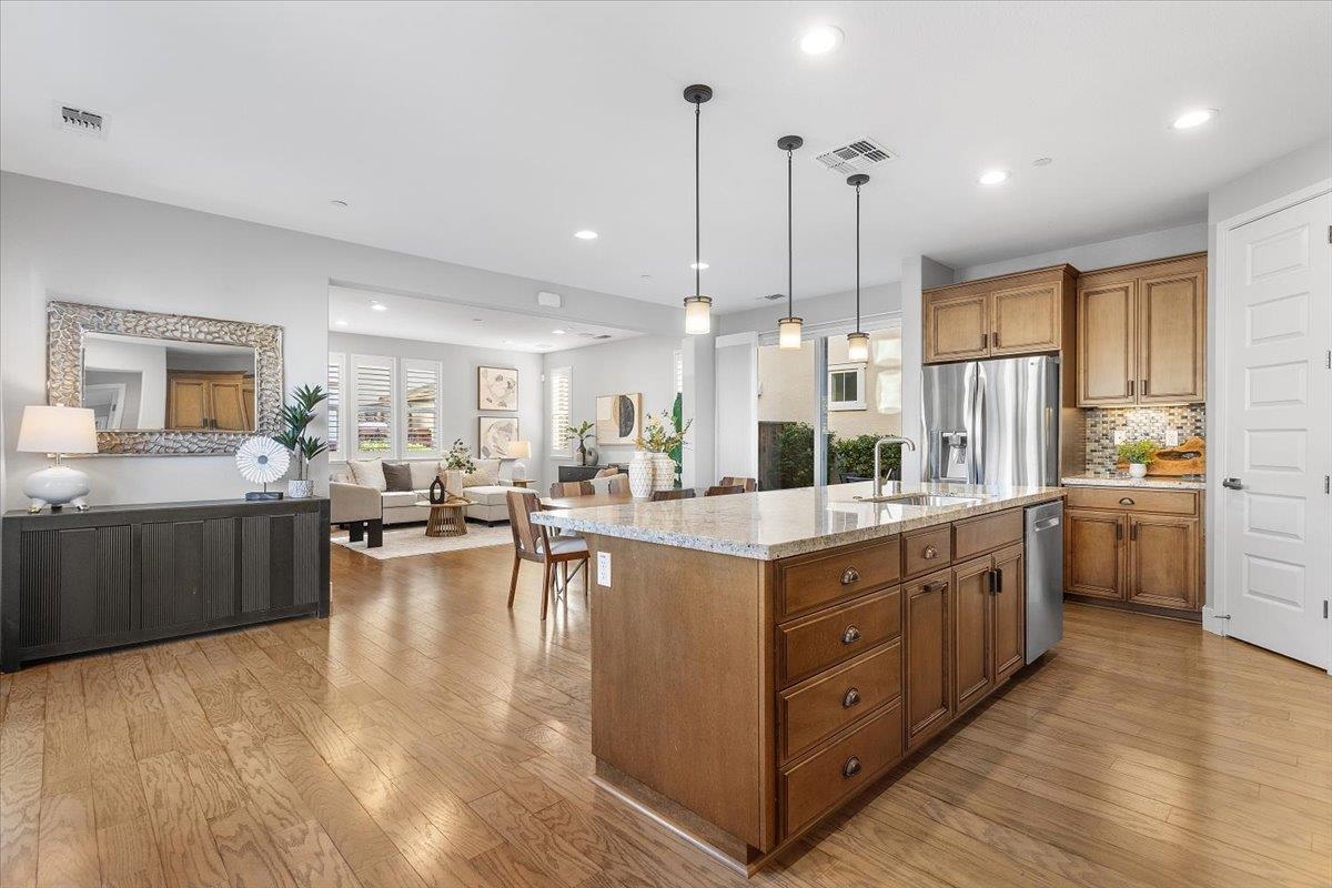 406 Mosley Avenue Alameda, CA 94501 - Photo 18 of 60 a large kitchen with kitchen island a large counter space a sink stainless steel appliances and cabinets