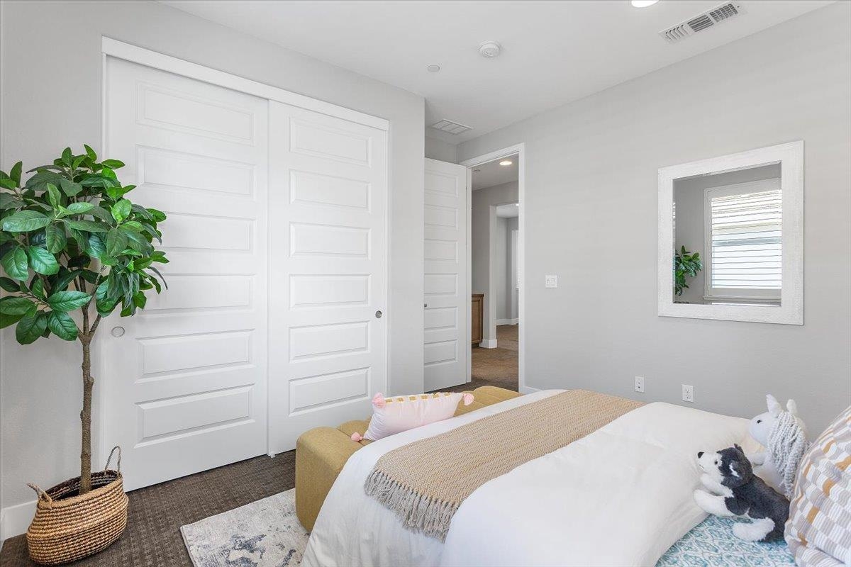 406 Mosley Avenue Alameda, CA 94501 - Photo 42 of 60 a bedroom with a bed and a potted plant