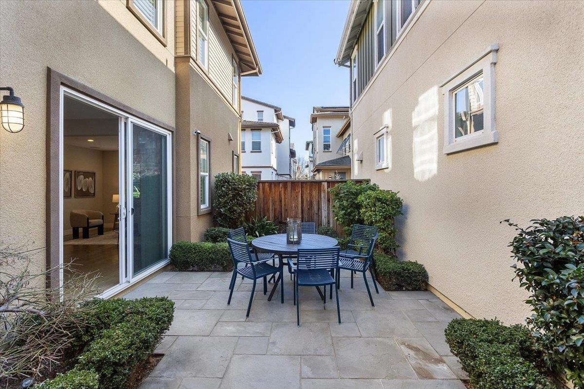 406 Mosley Avenue Alameda, CA 94501 - Photo 50 of 60 a view of a patio with a table and chairs and potted plants