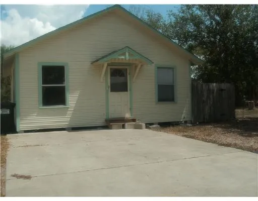 a house with trees in front of it