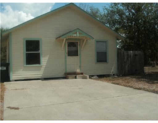 a house with trees in front of it