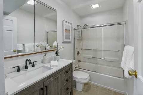 an entryway in wooden floor hall witha front door
