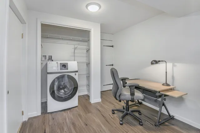 a spacious bathroom with a double vanity sink toilet and shower
