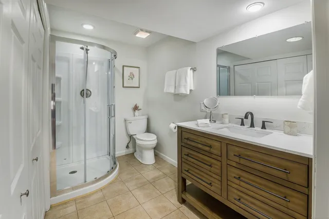 a view of a back yard with flower plants