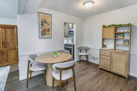 a workspace with furniture and wooden floor