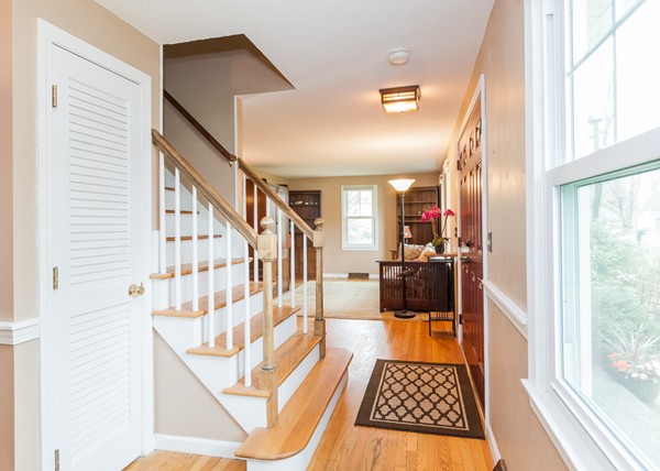 1053 Frank Smith Road Longmeadow, MA 01106 - Photo 13 of 30 a view of a hallway with wooden floor and staircase