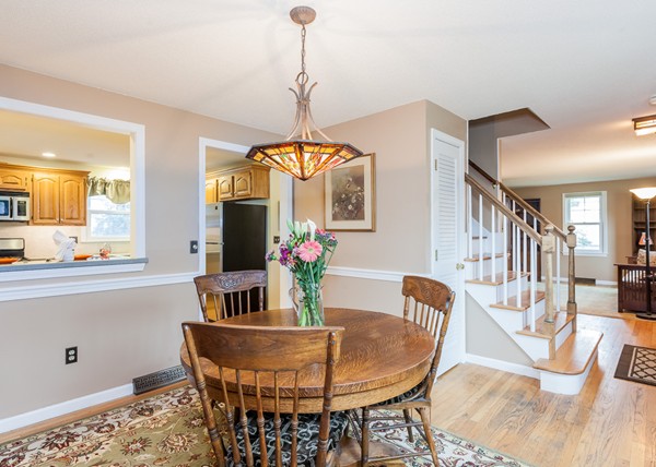 1053 Frank Smith Road Longmeadow, MA 01106 - Photo 14 of 30 a dining room with furniture a chandelier and wooden floor