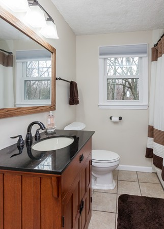 1053 Frank Smith Road Longmeadow, MA 01106 - Photo 22 of 30 a bathroom with a sink a toilet and a window
