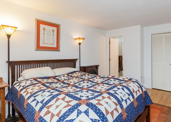 1053 Frank Smith Road Longmeadow, MA 01106 - Photo 26 of 30 a bedroom with a large bed and a closet