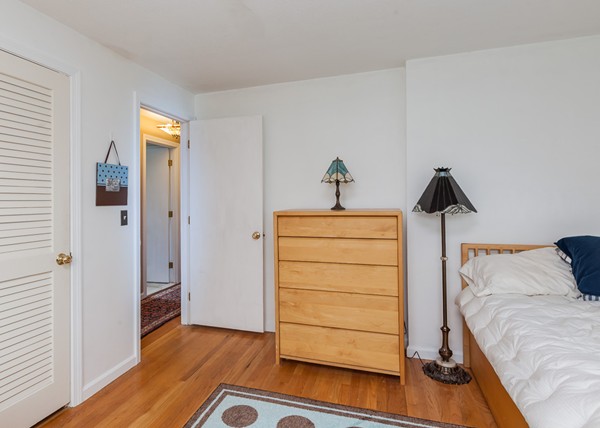 1053 Frank Smith Road Longmeadow, MA 01106 - Photo 30 of 30 a bedroom with a bed and wooden floor
