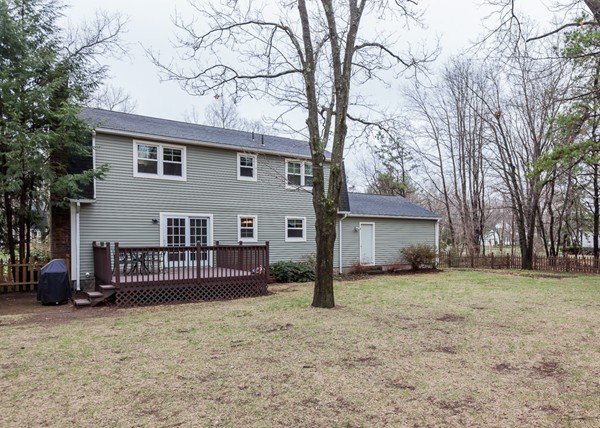 1053 Frank Smith Road Longmeadow, MA 01106 - Photo 5 of 30 a front view of a house with a yard and garage