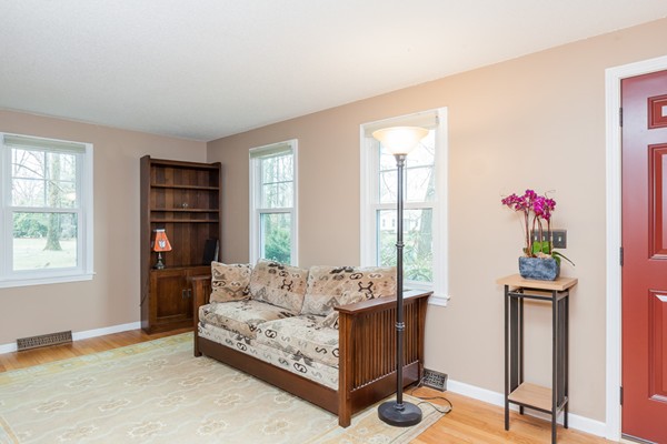 1053 Frank Smith Road Longmeadow, MA 01106 - Photo 9 of 30 a living room with furniture a bookshelf and a window