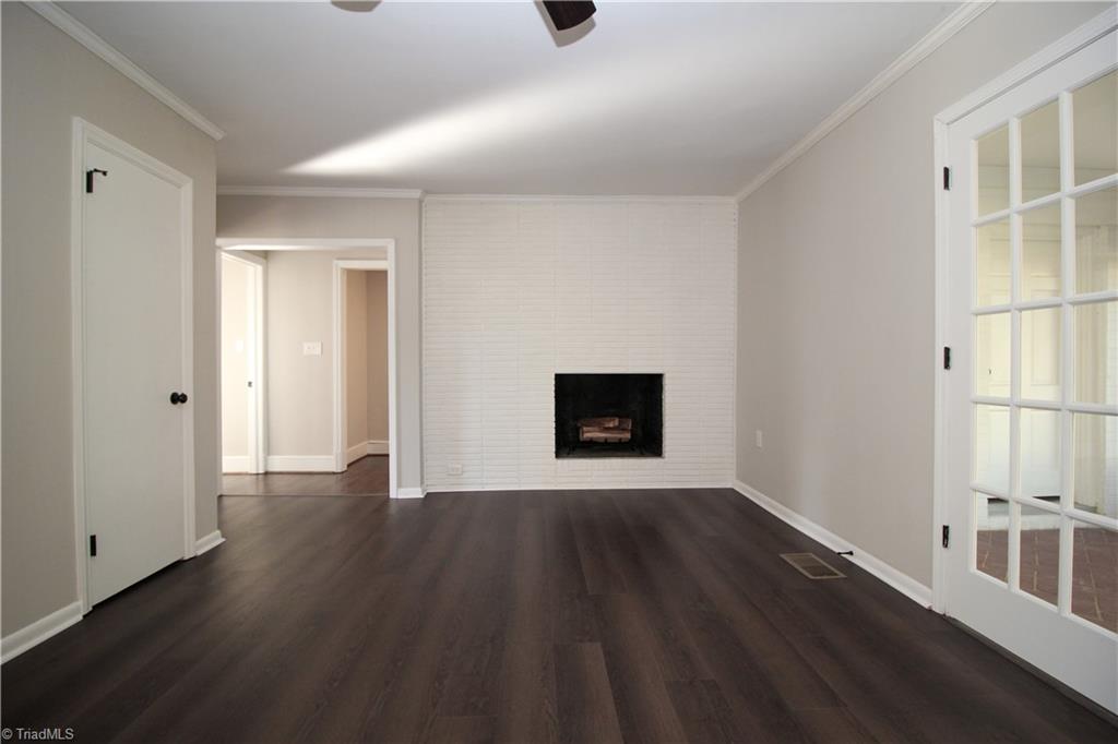 3705 Holts Chapel Road Greensboro, NC 27401 - Photo 16 of 33 Open kitchen / family room features a second wood burning fireplace