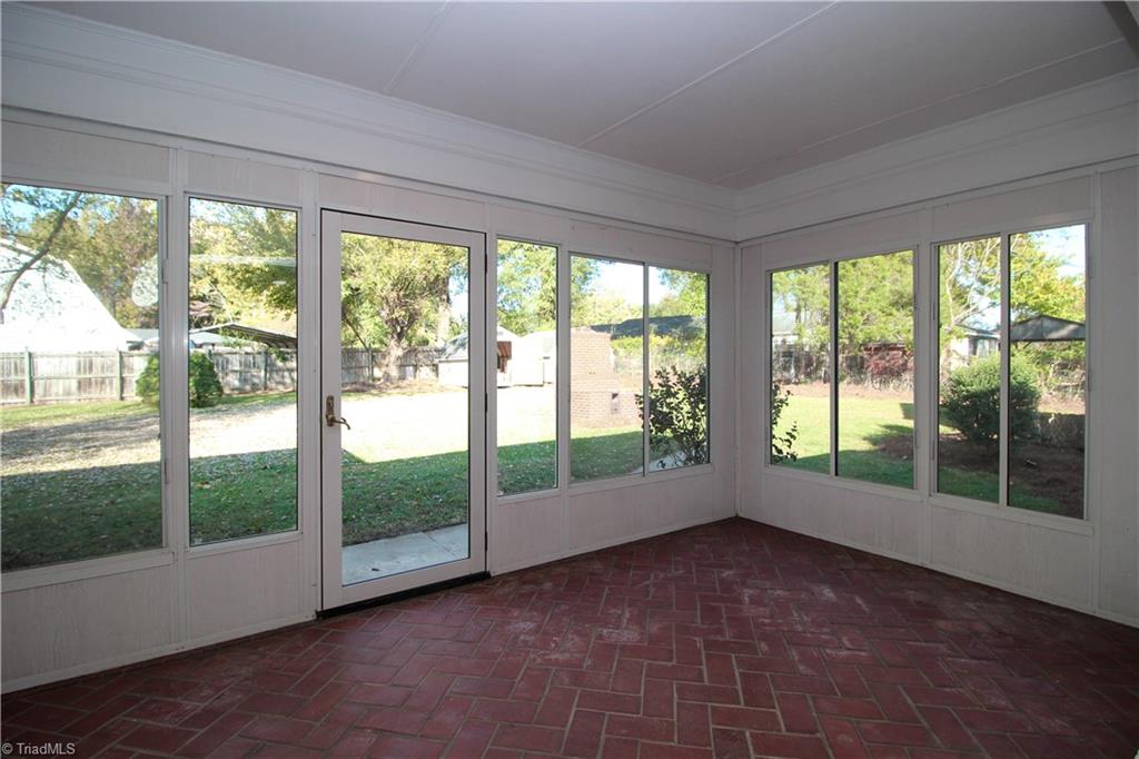 3705 Holts Chapel Road Greensboro, NC 27401 - Photo 18 of 33 Large windows showcase the expansive flat back yard