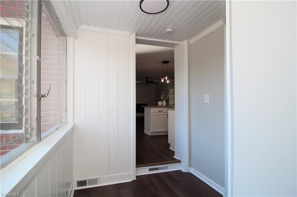 3705 Holts Chapel Road Greensboro, NC 27401 - Photo 28 of 33 Enclosed heated and cooled breezeway leads to third bedroom and garage