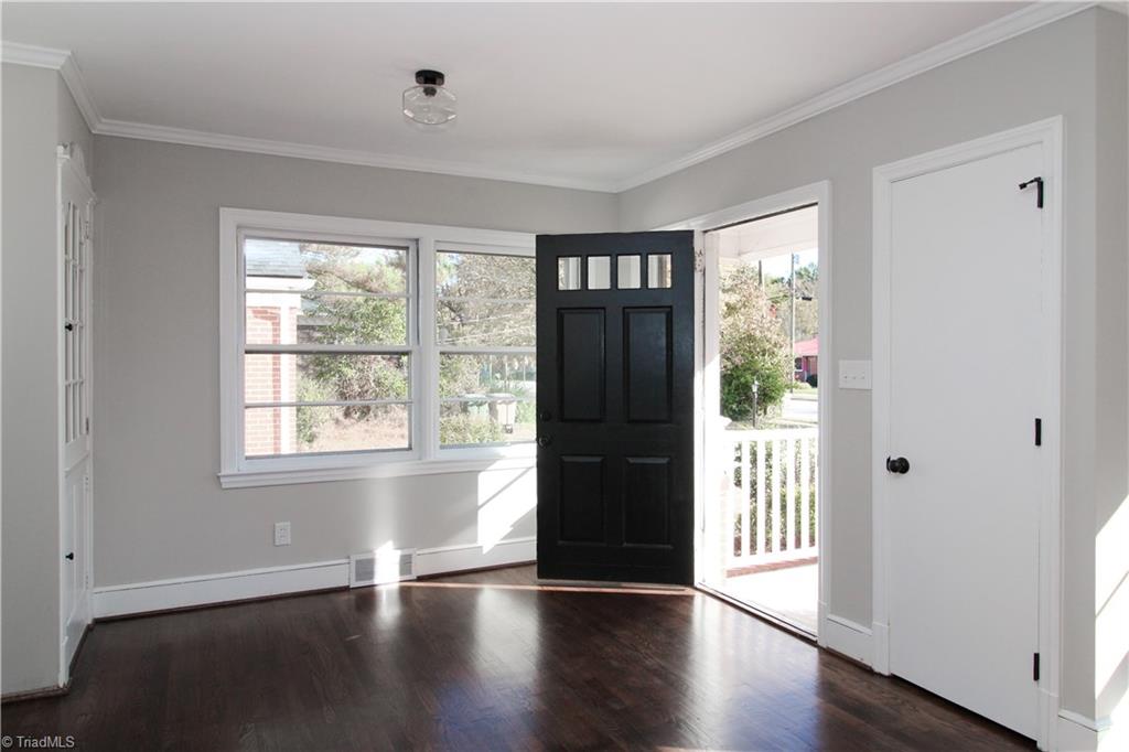 3705 Holts Chapel Road Greensboro, NC 27401 - Photo 4 of 33 Enter into main living space with real wood flooring