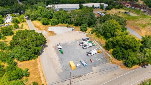 an aerial view of a house yard and swimming pool
