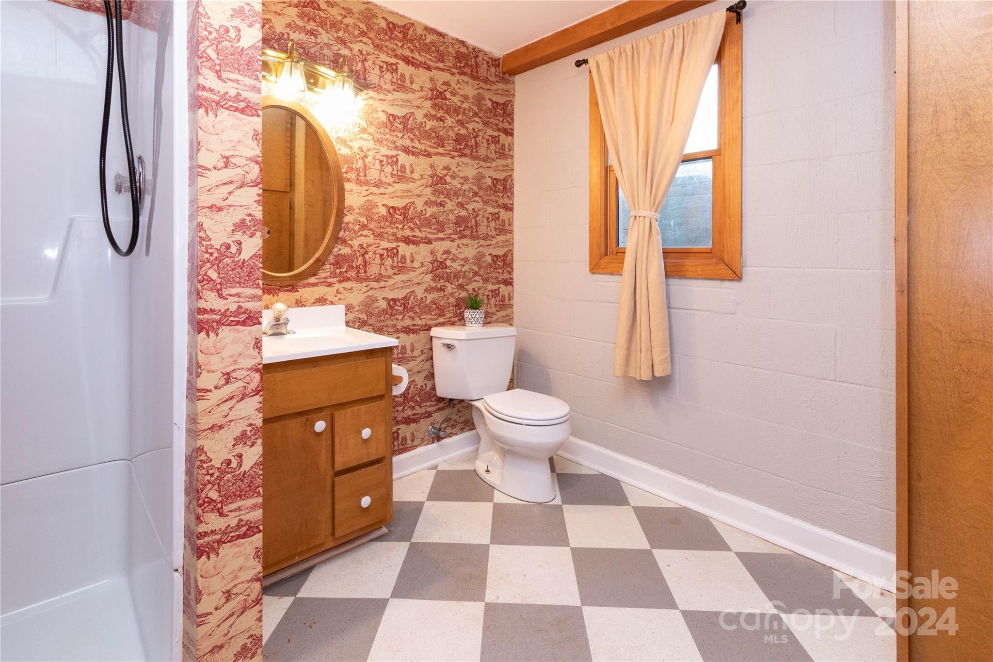 571 Bill Holbert Road Tryon, NC 28782 - Photo 25 of 46 a bathroom with a granite countertop bathtub and a toilet