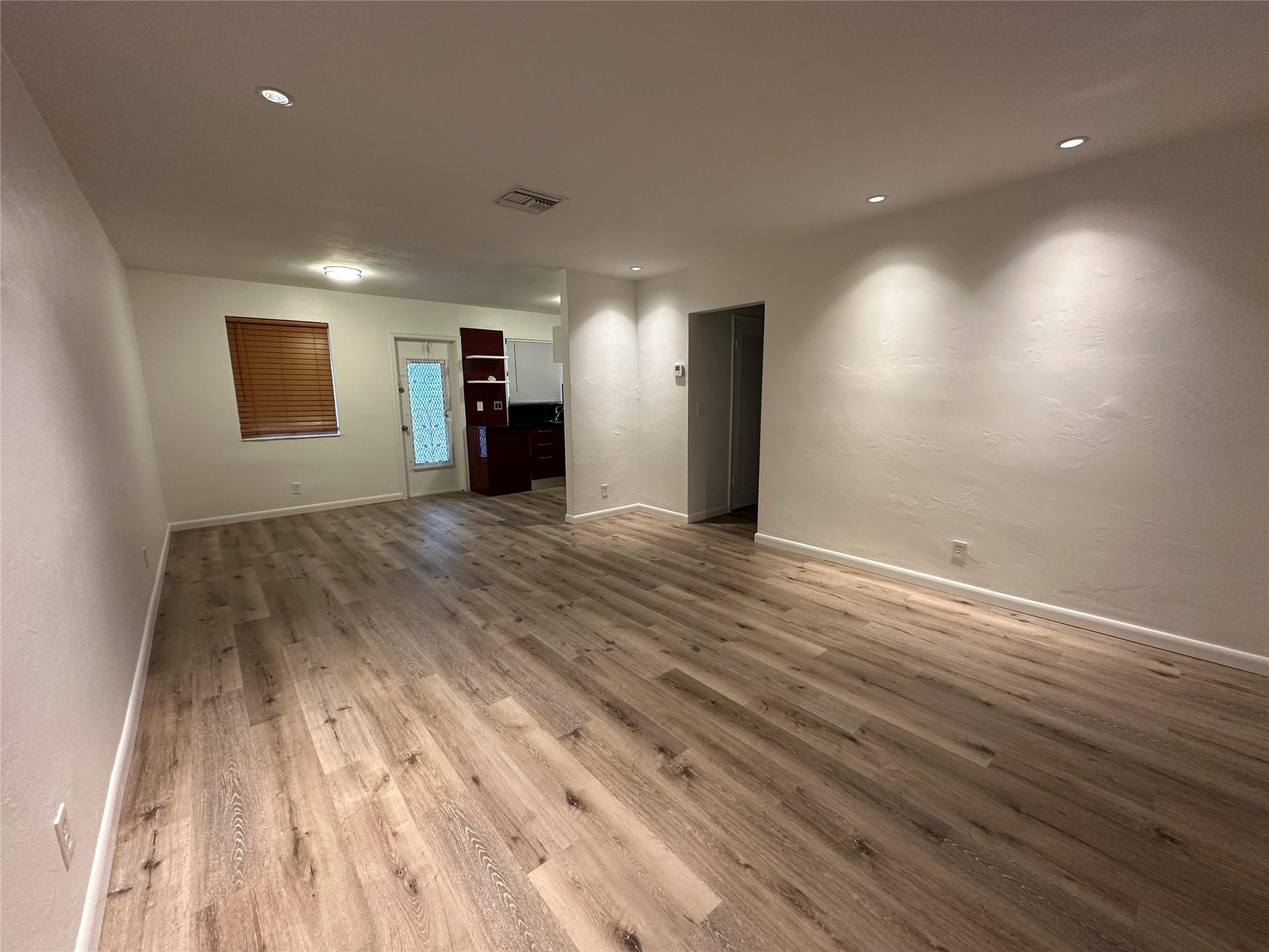 2222 Jackson Street Hollywood, FL 33020 - Photo 1 of 1 an empty room with wooden floor and windows