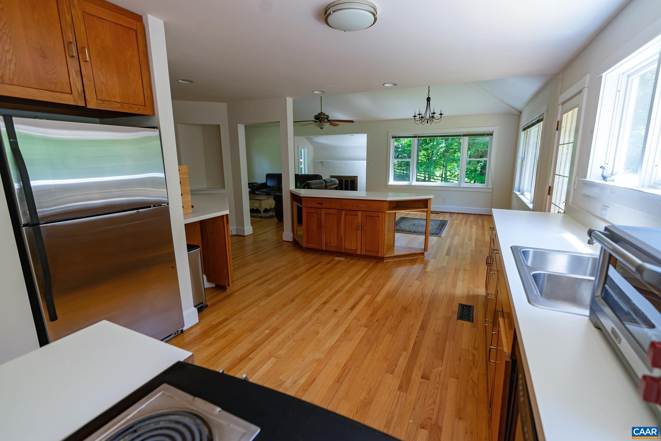 2601 Cardinal Ridge Road Charlottesville, VA 22901 - Photo 15 of 50 a kitchen with wooden floors and glass windows