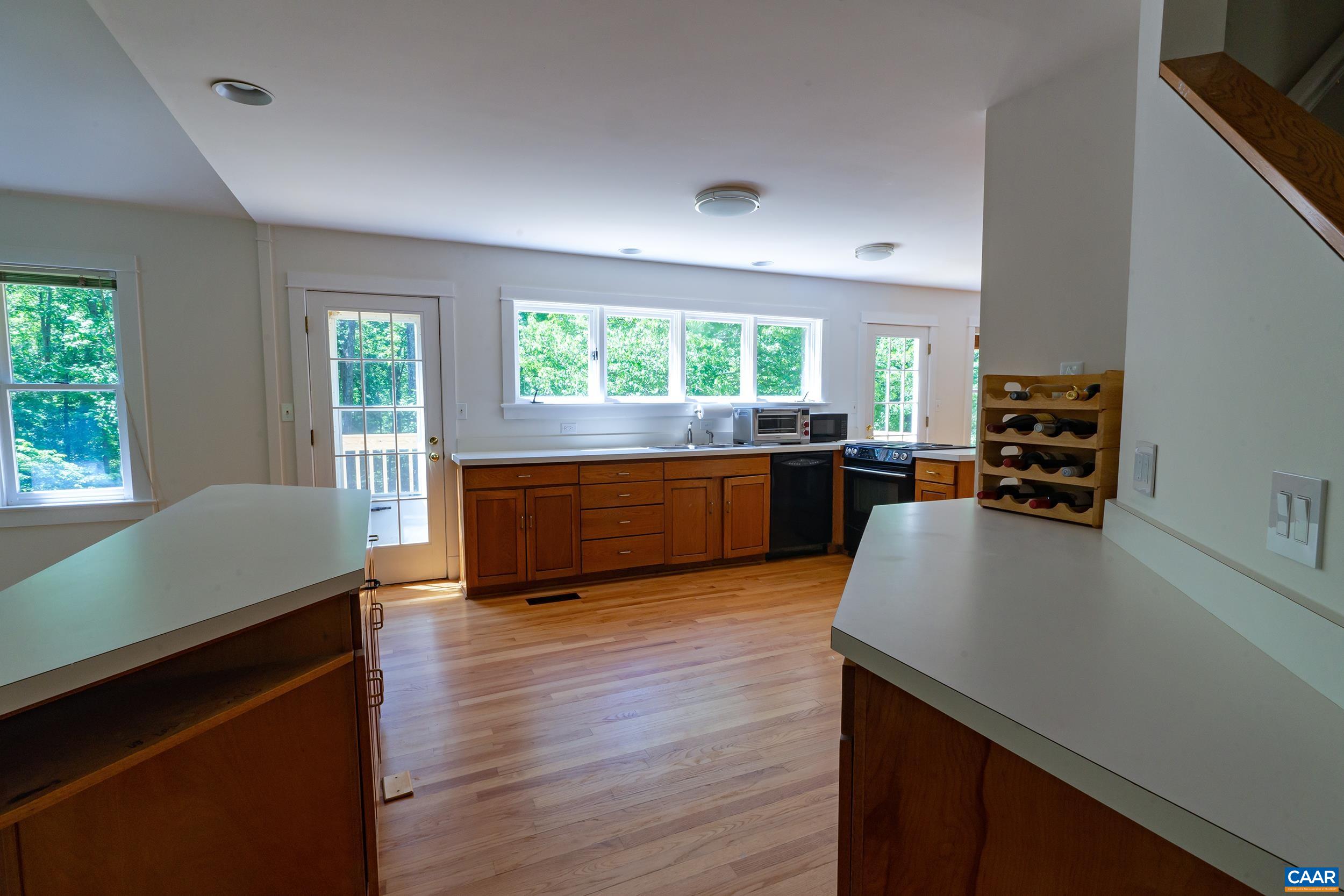 2601 Cardinal Ridge Road Charlottesville, VA 22901 - Photo 4 of 50 a kitchen with stainless steel appliances granite countertop a stove and a refrigerator