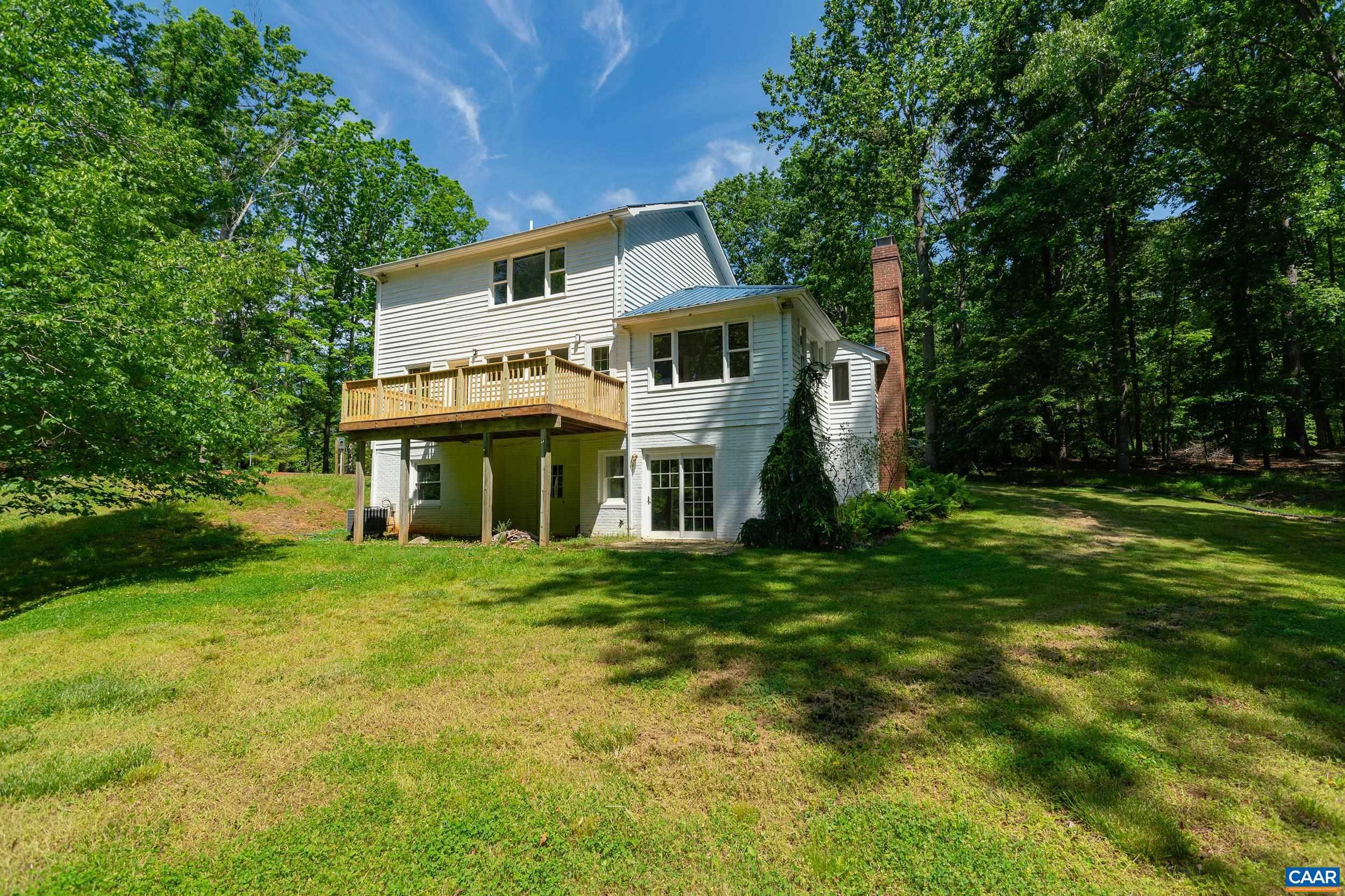2601 Cardinal Ridge Road Charlottesville, VA 22901 - Photo 42 of 50 a front view of a house with a garden