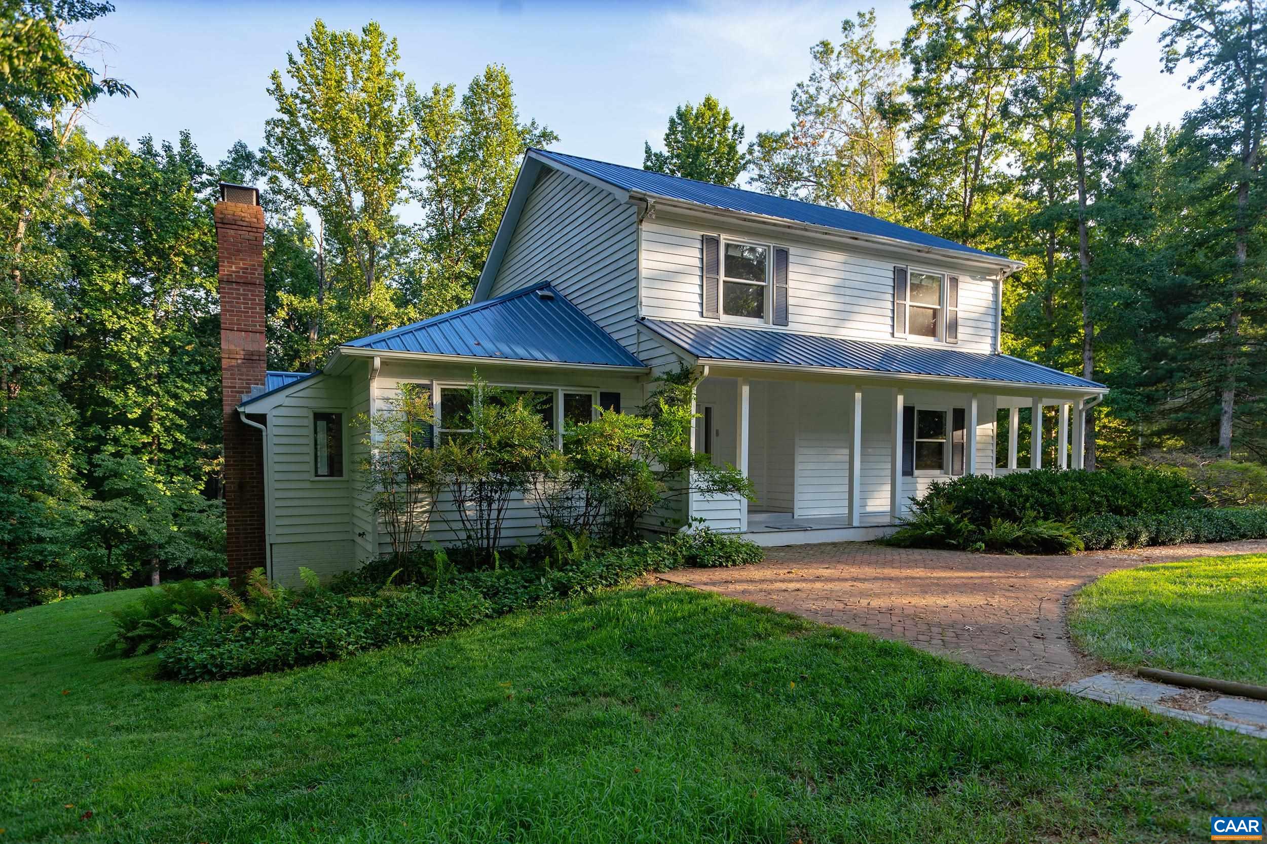 2601 Cardinal Ridge Road Charlottesville, VA 22901 - Photo 49 of 50 a front view of a house with a yard