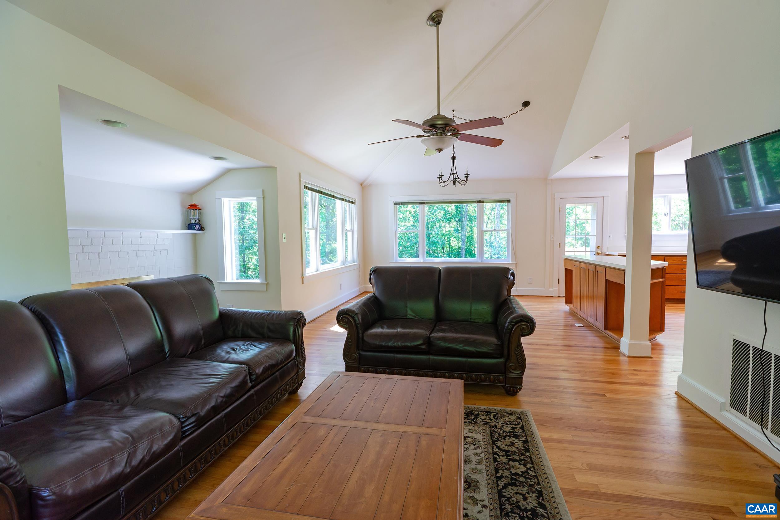 2601 Cardinal Ridge Road Charlottesville, VA 22901 - Photo 7 of 50 a living room with furniture and a fireplace