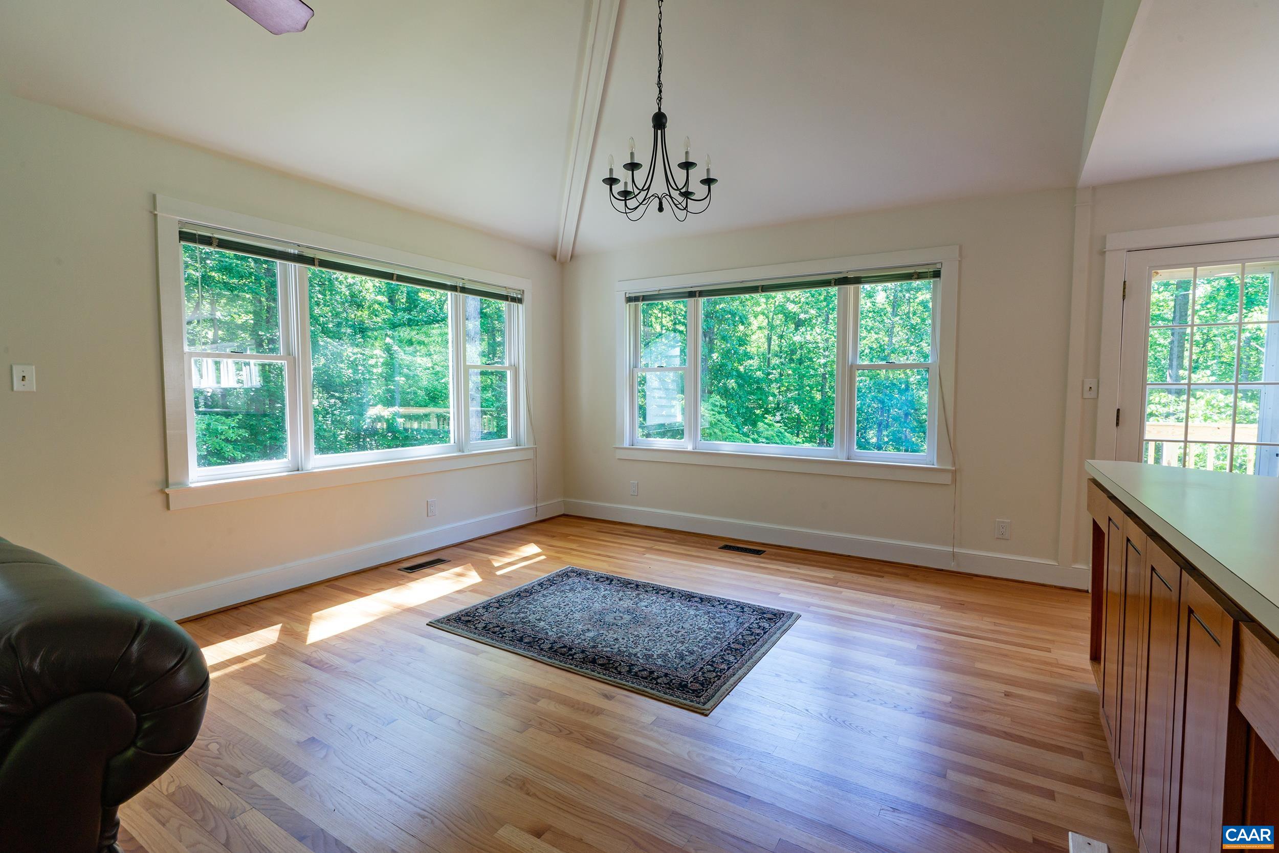 2601 Cardinal Ridge Road Charlottesville, VA 22901 - Photo 10 of 50 a view of an empty room with wooden floor and a window
