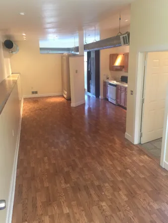 a view of entryway with wooden floor and window