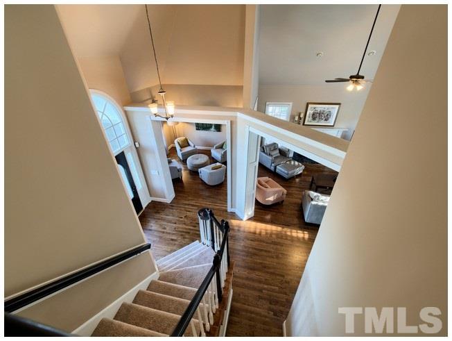 8000 Kukui Court Raleigh, NC 27613 - Photo 4 of 25 a view of a living room with furniture and a flat screen tv