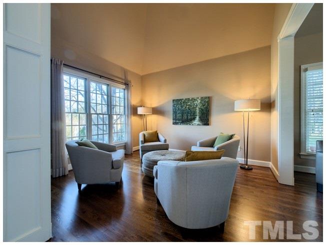 8000 Kukui Court Raleigh, NC 27613 - Photo 5 of 25 a living room with furniture and a large window