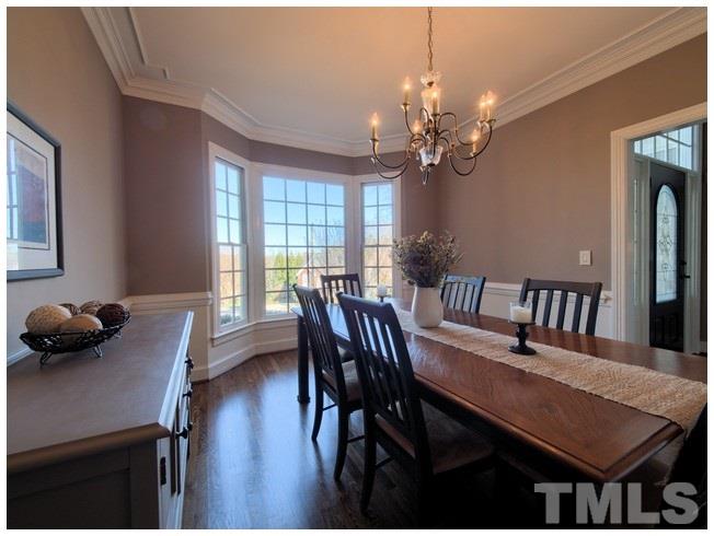 8000 Kukui Court Raleigh, NC 27613 - Photo 6 of 25 a view of a dining room with furniture and window