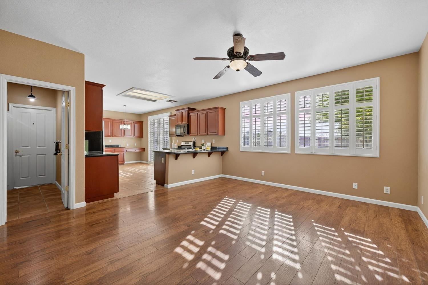 1716 Presidio Way Plumas Lake, CA 95961 - Photo 15 of 43 a view of a living room and kitchen with wooden floor