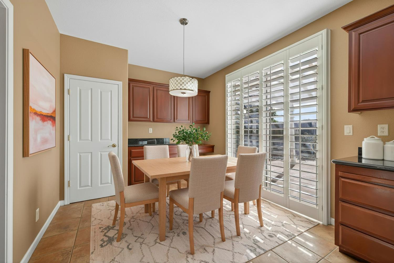 1716 Presidio Way Plumas Lake, CA 95961 - Photo 19 of 43 a view of a dining room with furniture window and wooden floor