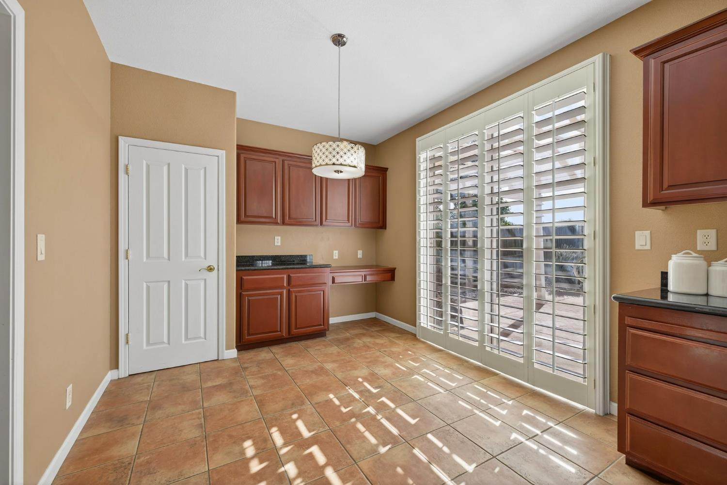 1716 Presidio Way Plumas Lake, CA 95961 - Photo 20 of 43 a open kitchen with granite countertop a stove top oven a sink and cabinets
