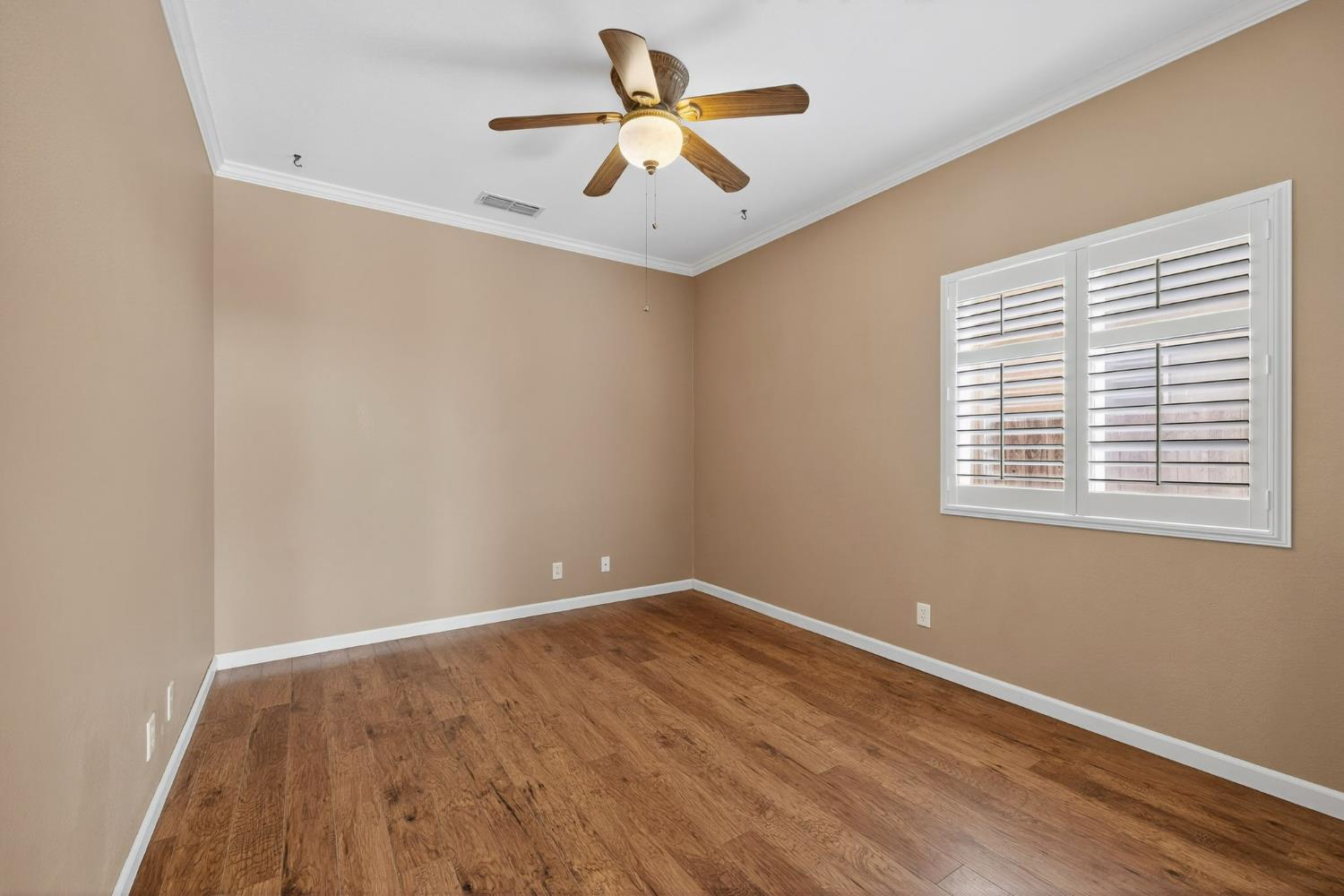 1716 Presidio Way Plumas Lake, CA 95961 - Photo 23 of 43 an empty room with a window and a ceiling fan